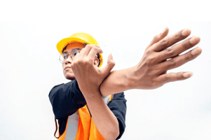 man stretches, warehouse attire, safety, workplace safety